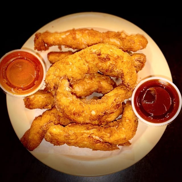 Fried chicken tenders with dipping sauces at Cluck-A-Doodle-Doo